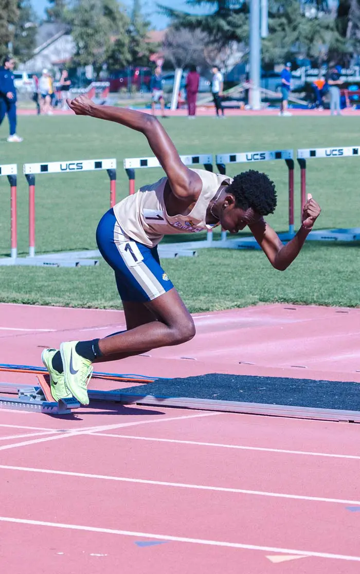 Track runner taking off