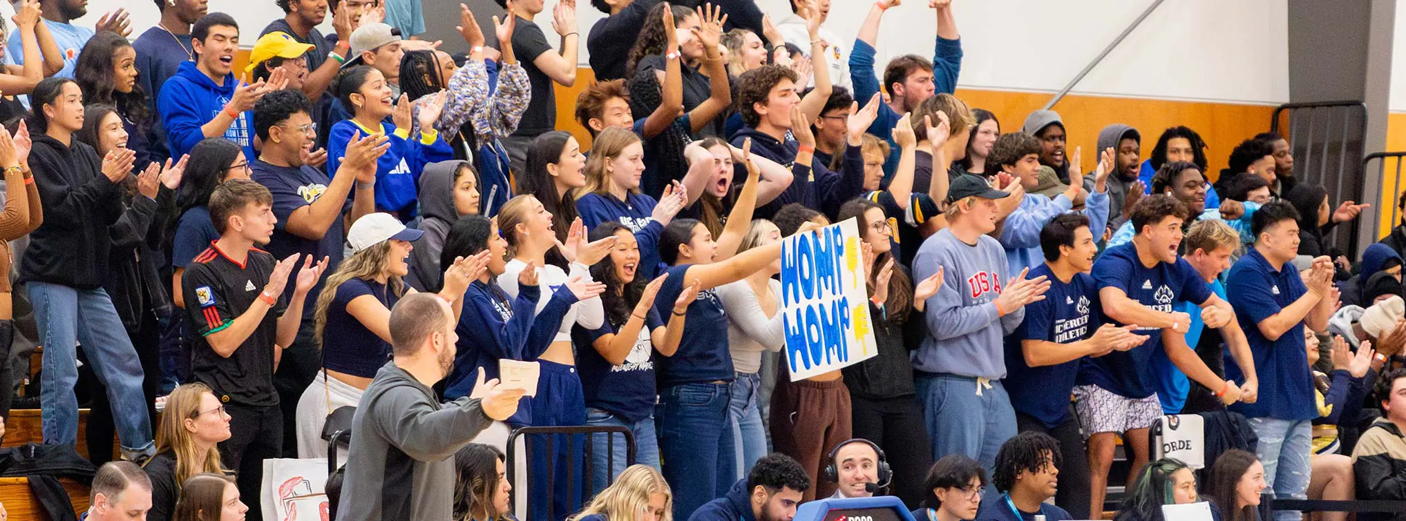 Fans posing with the mascot